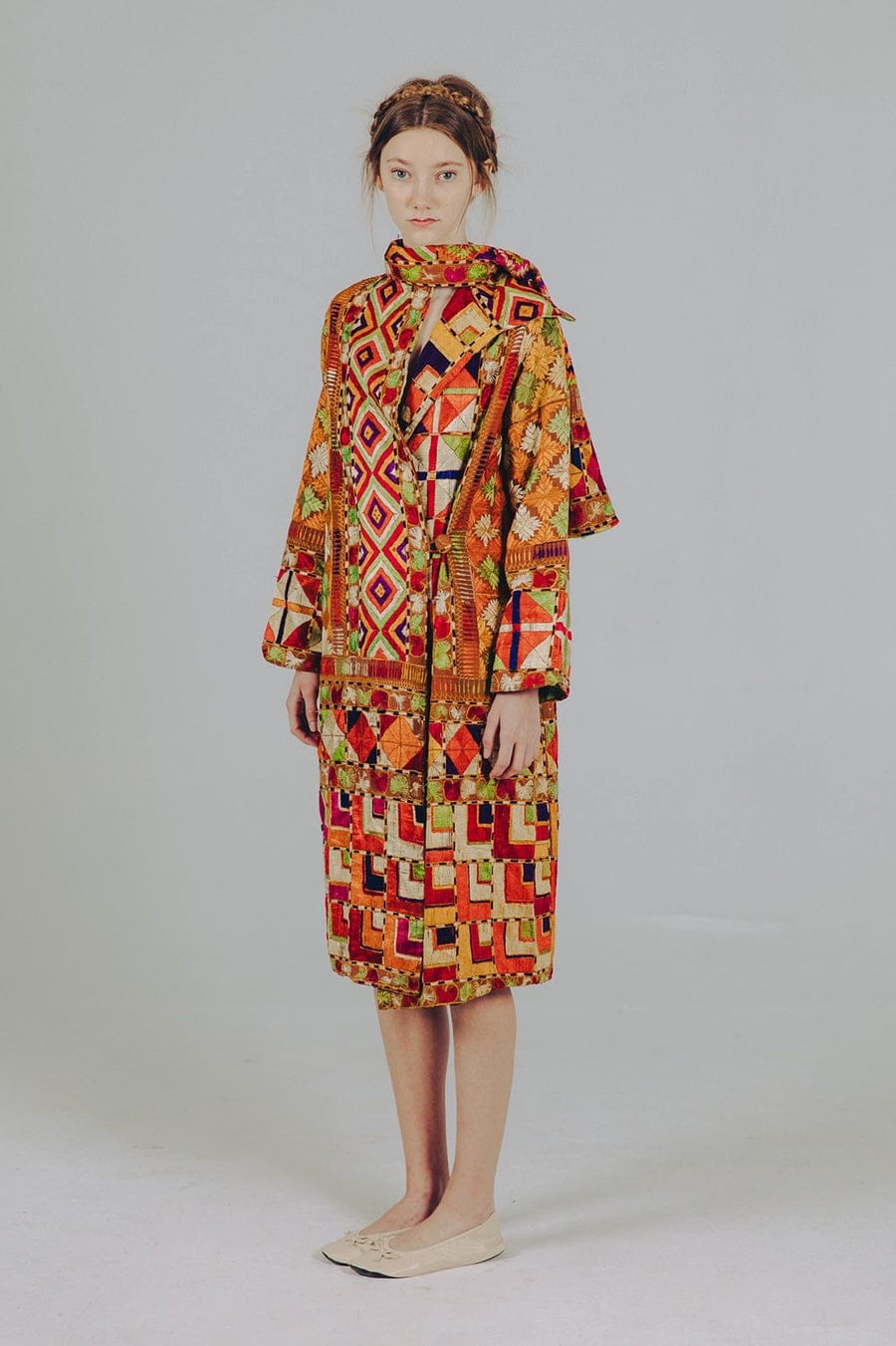 Embroidered silk coat worn by model